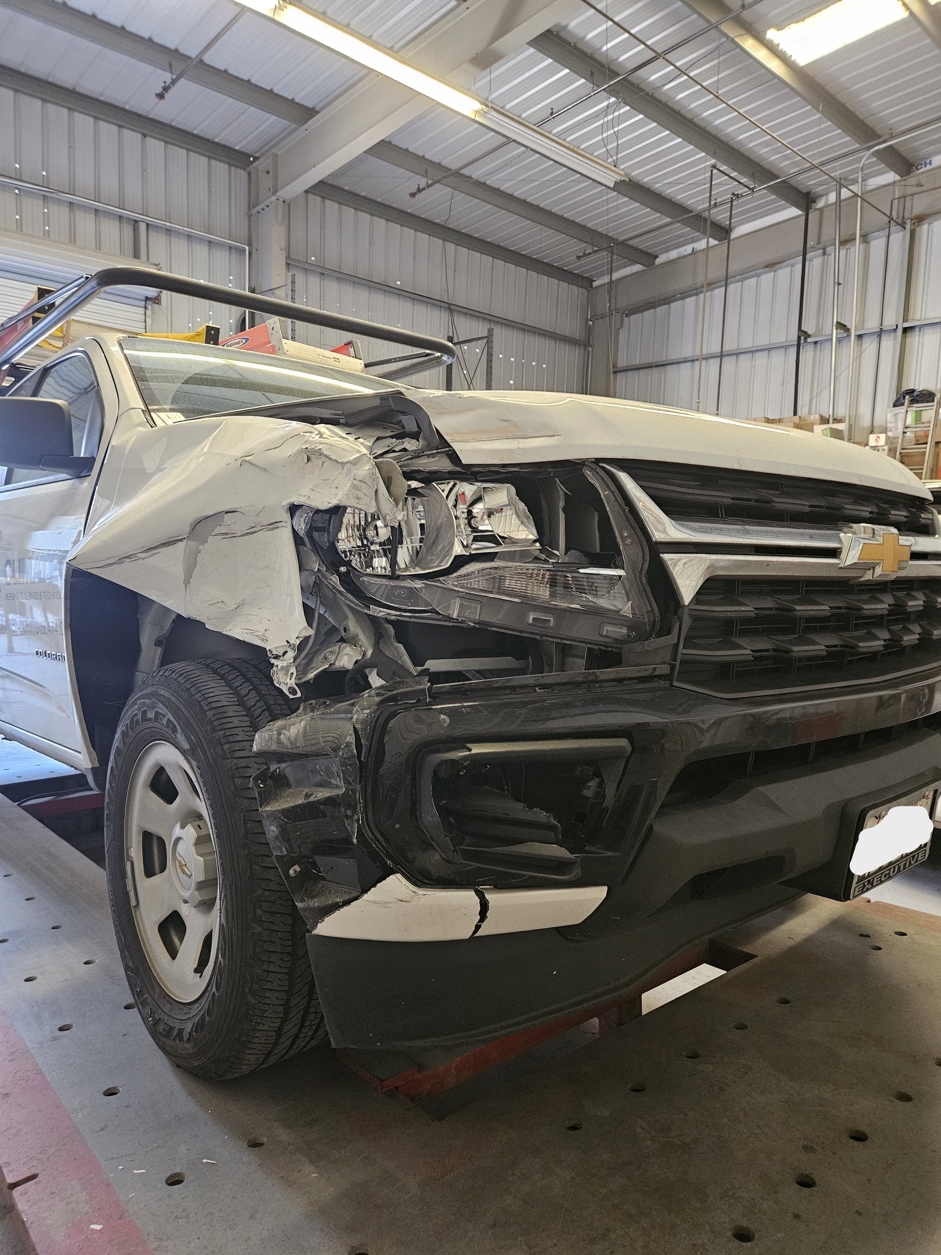 White truck collision damage before repair